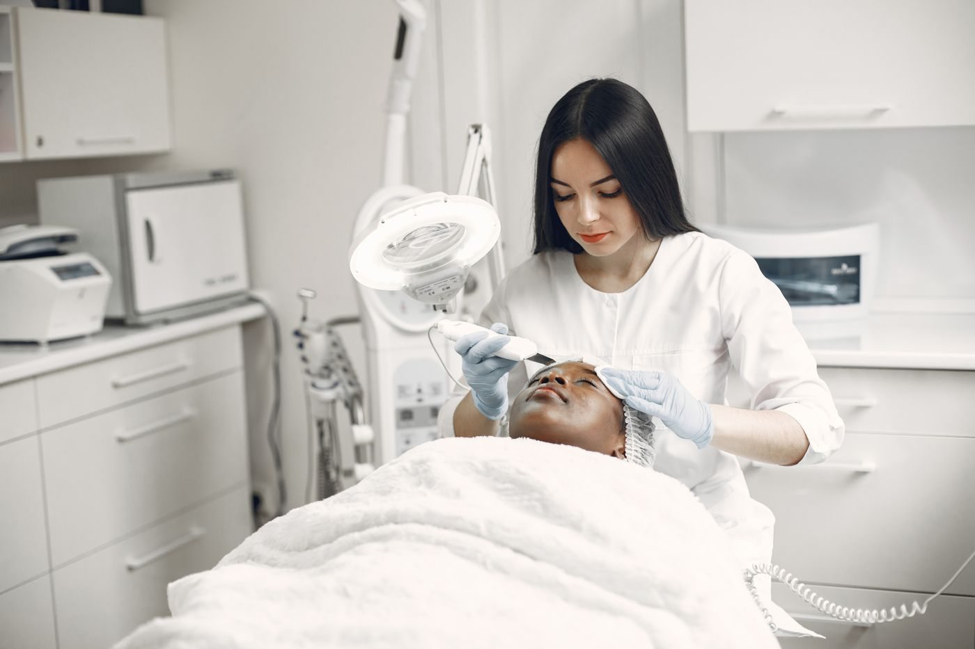 A physician assessing a patient at Skin&Co, Mississauga