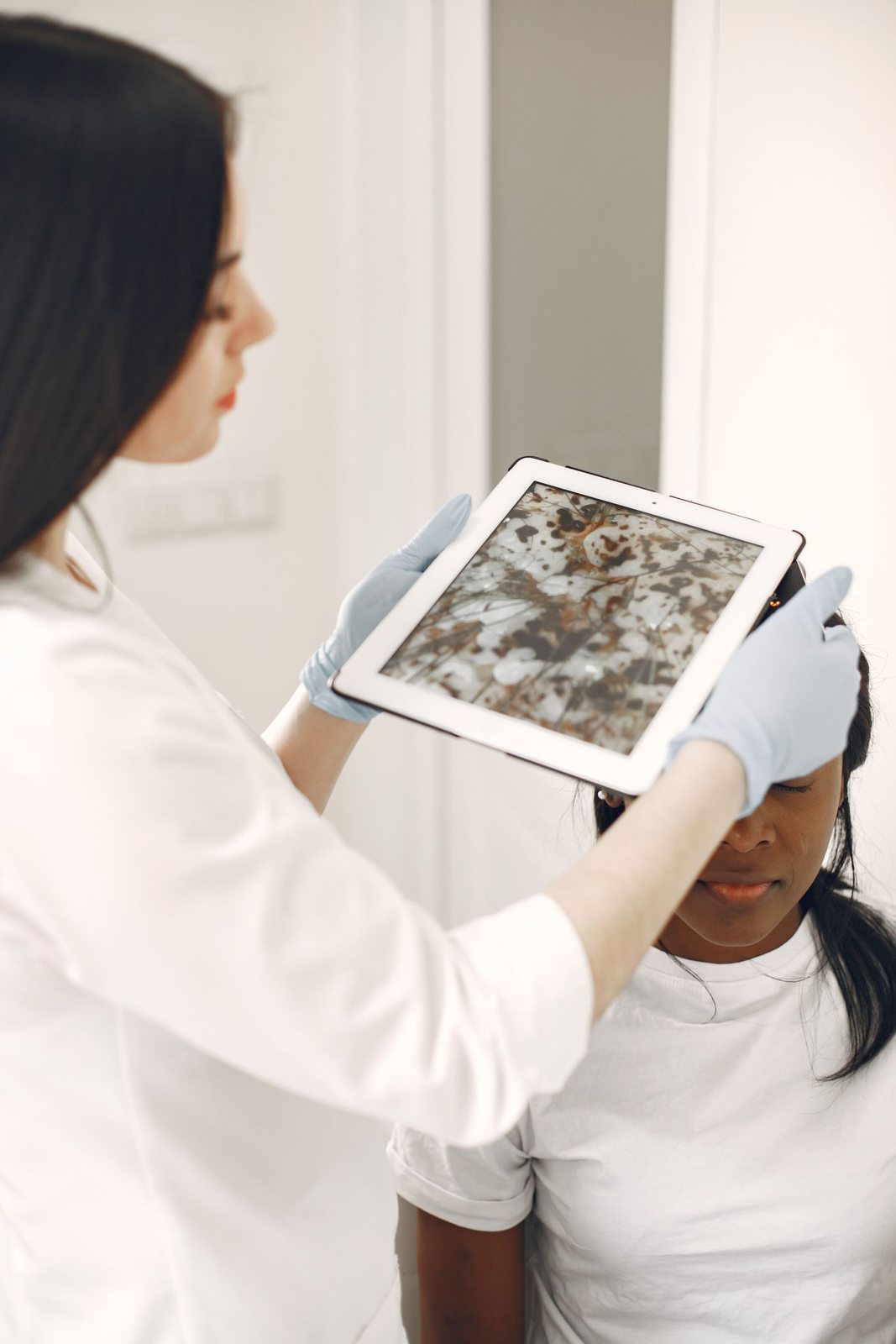 A physician assessing a patient at Skin&Co, Mississauga