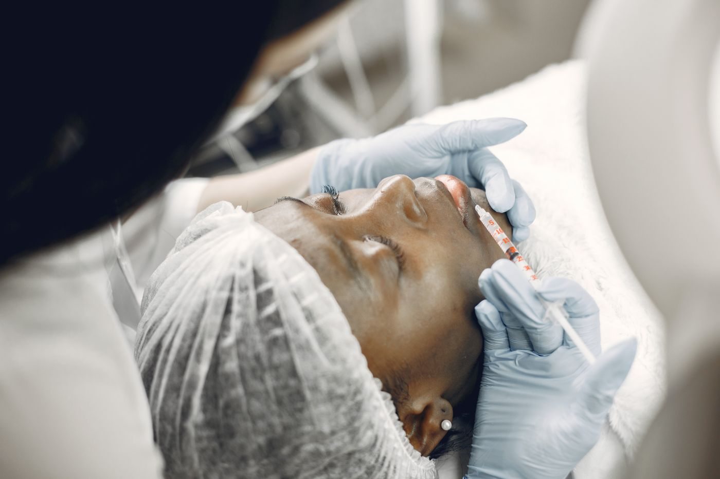 A physician assessing a patient at Skin&Co, Mississauga