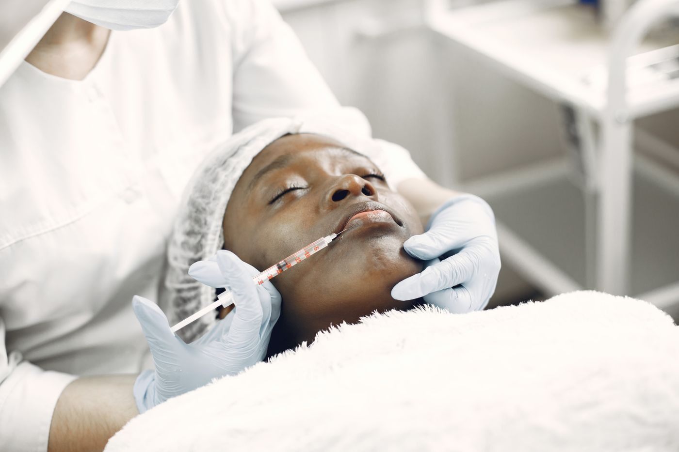 A physician assessing a patient at Skin&Co, Mississauga